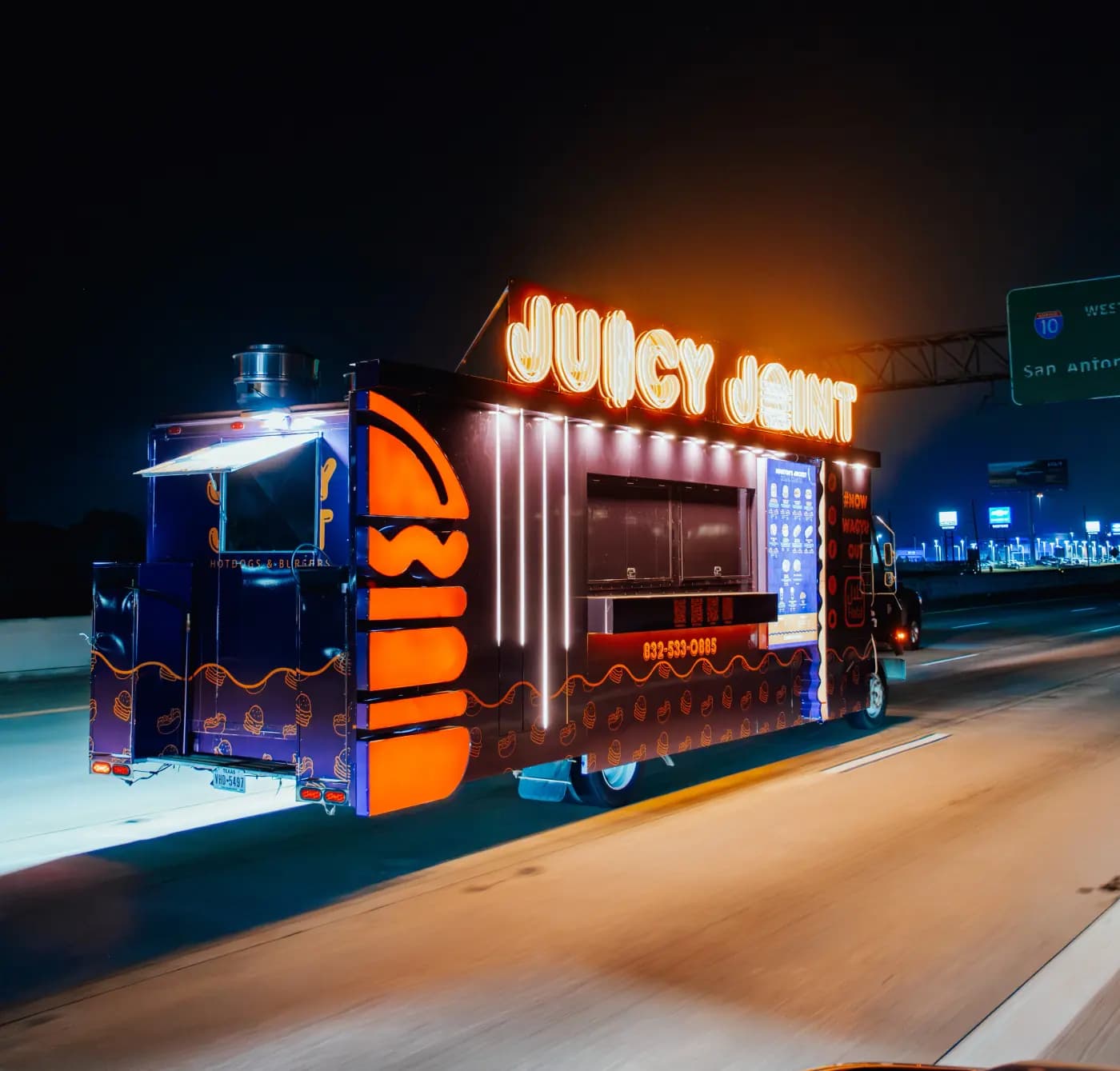 The Juicy Joint food truck set up for an event catering service